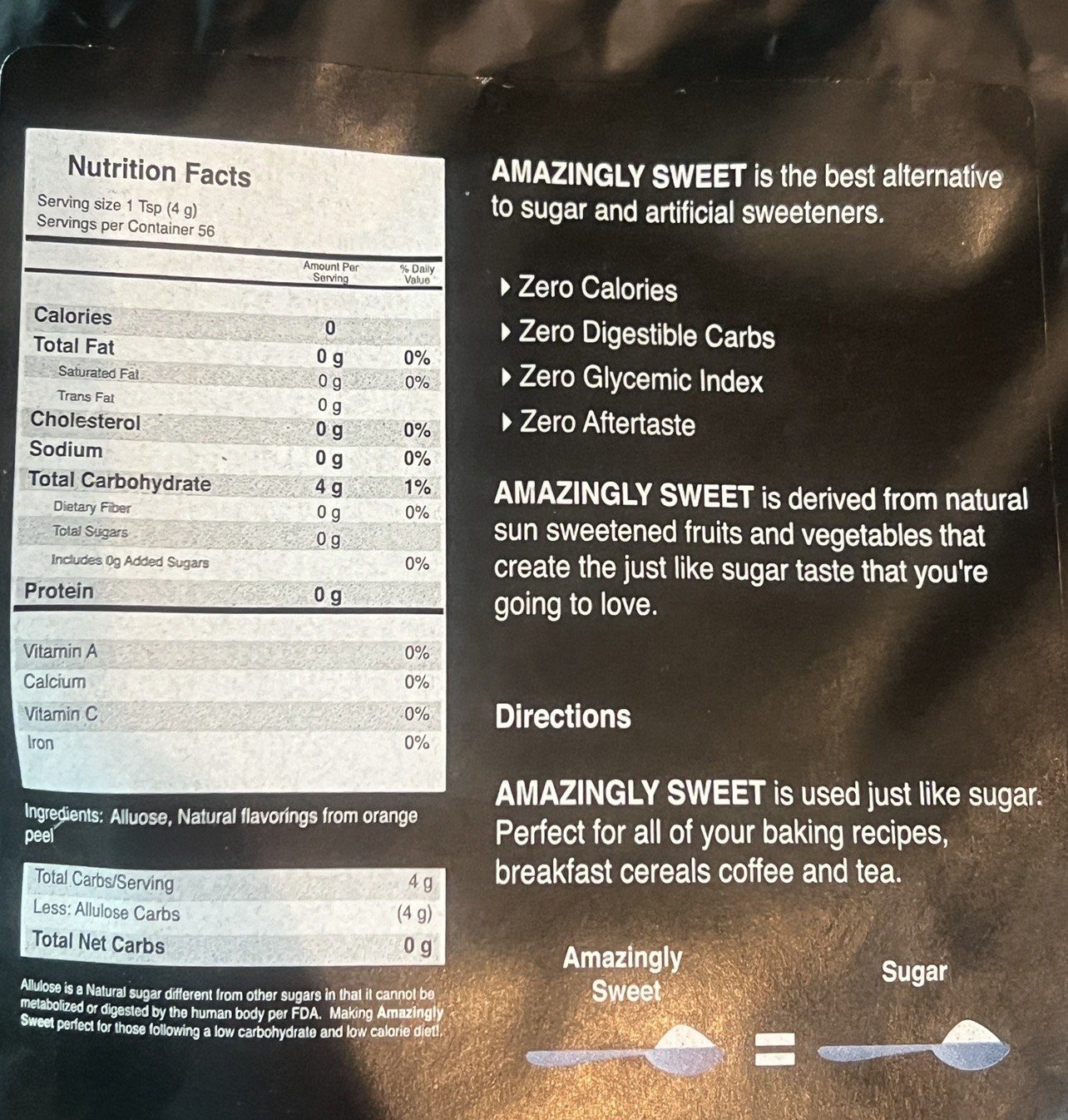 Clear back label of Amazingly Sweet showing nutrition facts, allulose and orange peel ingredients, and a 1 to 1 spoon comparison with sugar